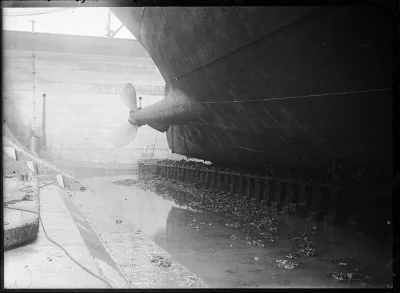 Ship hull and propeller in dry dock, where antifouling paint types are chosen and applied