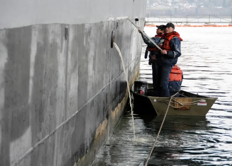 Marine topcoats and finishes applied to a ship hull by a sailor