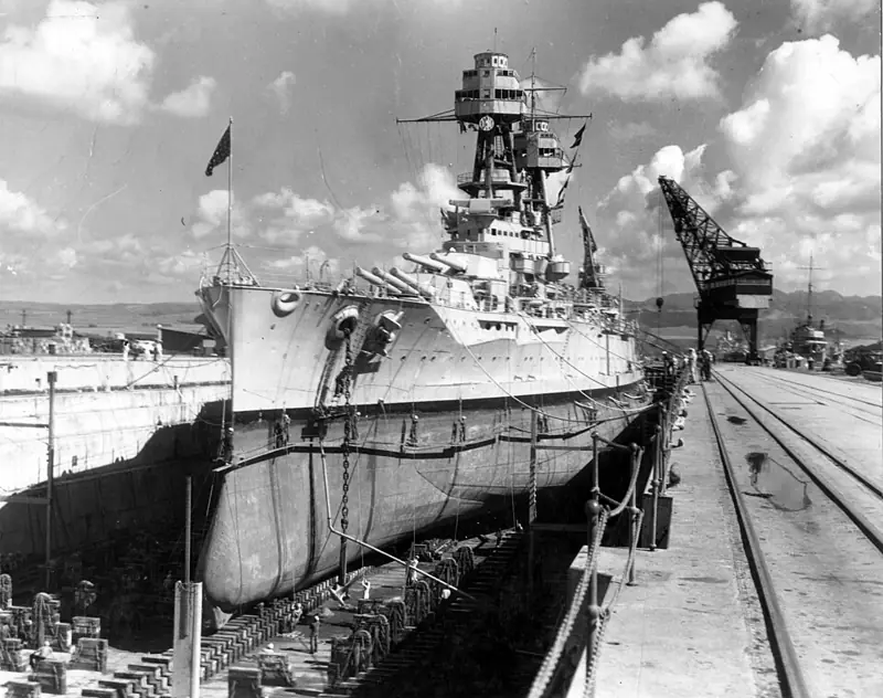 Hull coating condition survey of a battleship resting in dry dock