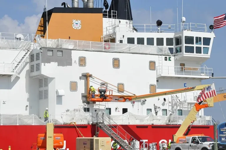 Marine coating specification step one: abrasive blasting the hull of a Coast Guard cutter