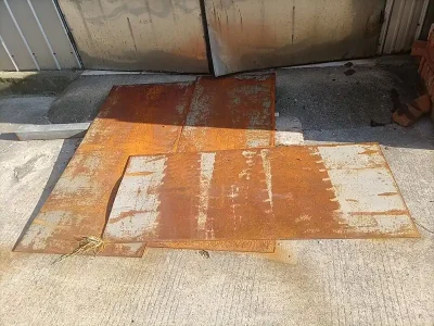 Rusty steel plate showing flash rust on corroded steel surface