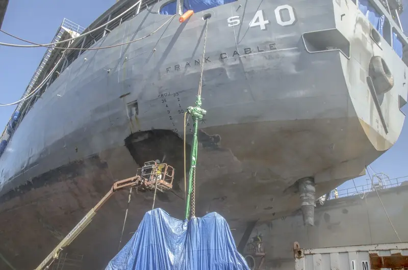 Ship hull in dry dock where cold steel collects condensation overnight